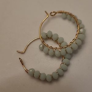 Hoop earrings with light blue beads